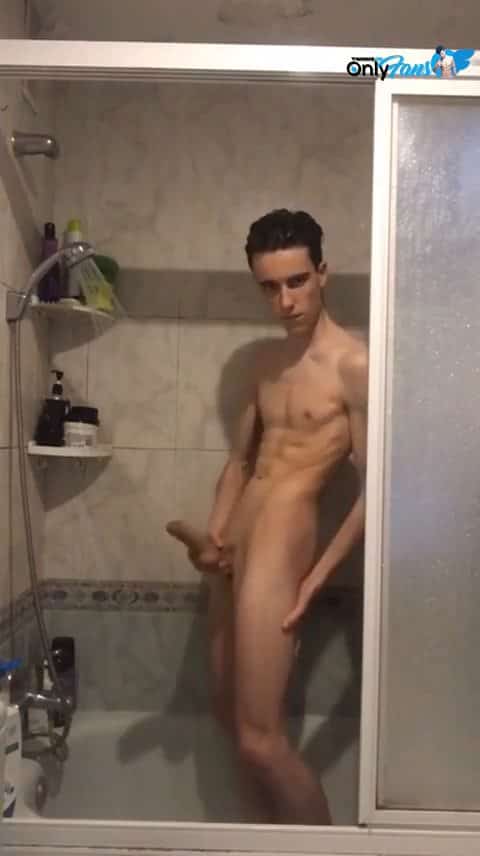 handsome twink taking a shower and swinging his long cock around